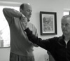 Senior Alexander Technique teacher helping an intermediate student